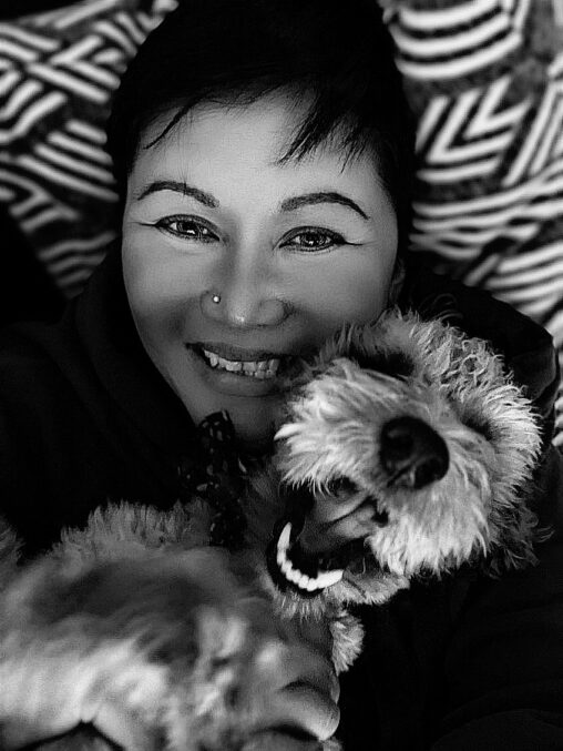Christianne with her pup Mosley in black and white